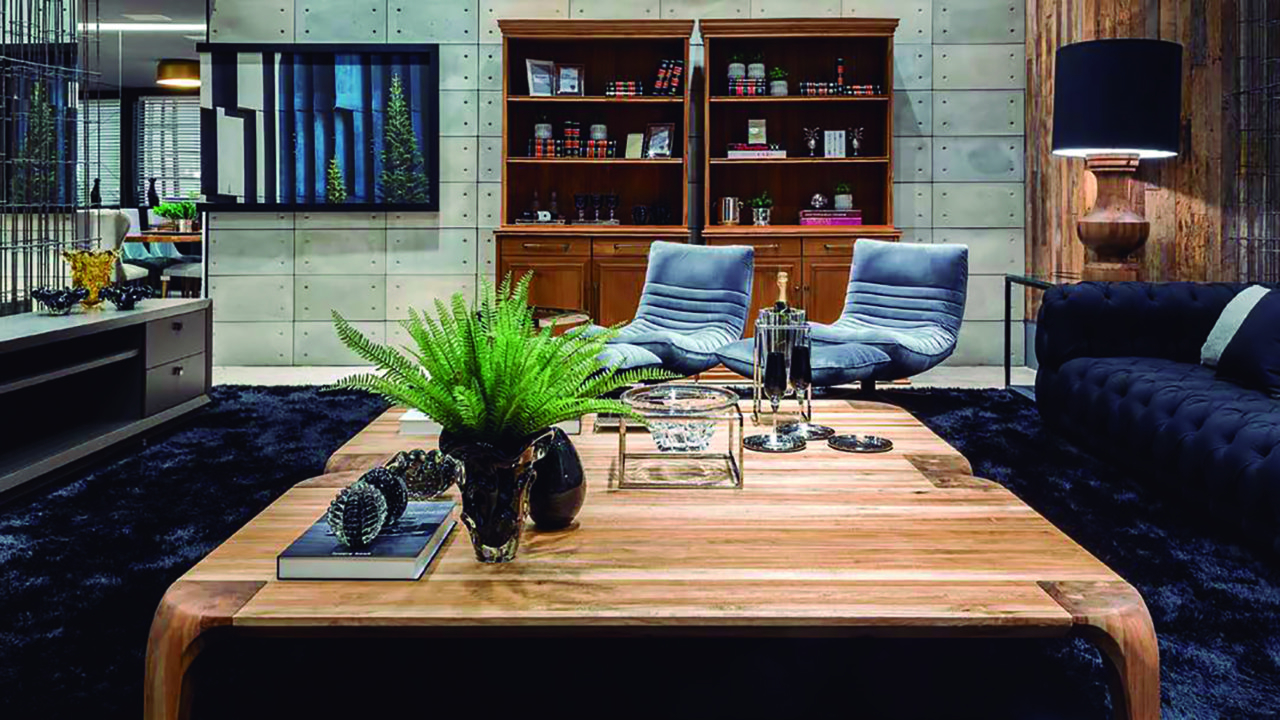 O mix de materiais do mobiliário e decoração aquece o ambiente dessa sala da Sierra Curitiba. 